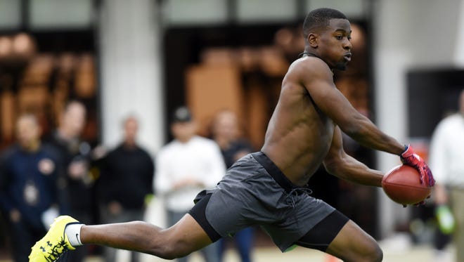 Former Colorado University defensive back Chidobe Awuzie goes through coverage drills for NFL football scouts Wednesday, March 8, 2017, during Colorado's pro day in Boulder, Colo.