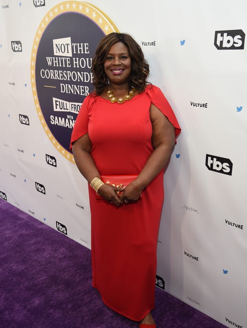 Retta, whose 'Parks and Recreation' character brought "Treat Yo Self Day" into fans' lives, hits the press line in a regal red gown.