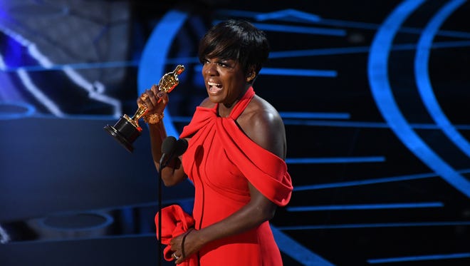Viola Davis accepts the Oscar for Best Supporting Actress for her role in 'Fences' during the 89th Academy Awards.