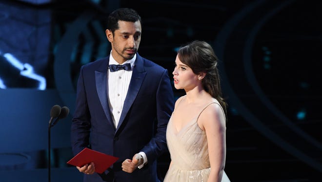 Riz Ahmed and Felicity Jones presents the award for Achievement in visual effects during the 89th Academy Awards.