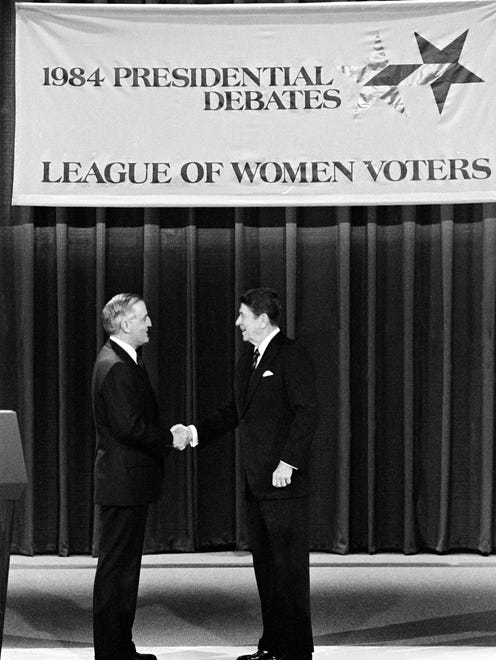 Reagan and Walter Mondale shake hands before their debate in Louisville, Ky., on Oct. 7, 1984.