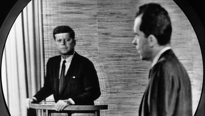Kennedy and Nixon take part in the Oct. 7, 1960, debate in Washington, as seen in this view from a television screen.