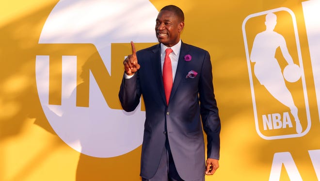 Dikembe Mutombo poses for photos on the red carpet before the 2017 NBA Awards.