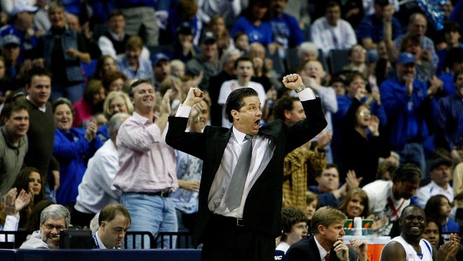 January 5, 2008 - Memphis head coach John Calipari, middle, pumps up the crowd during first half action of a Tigers 90-53 victory over Pepperdine.