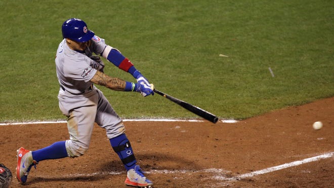 ... Javier Baez drives in the go-ahead run to give the Cubs a 6-5 lead.