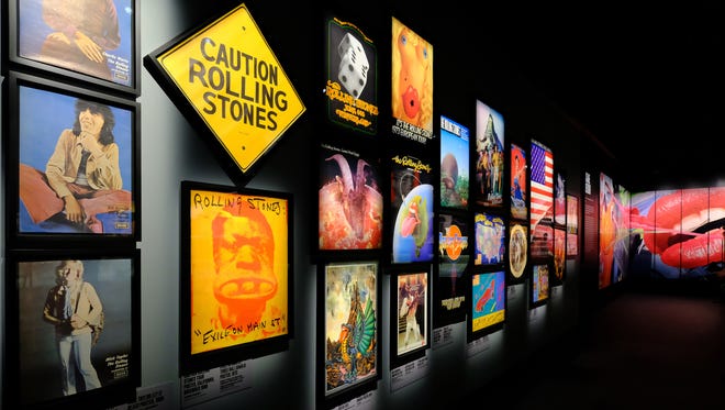 Album covers and tour posters line the walls of 'Exhibitionism.'
