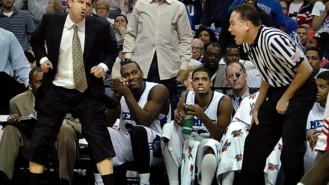 March 10, 2006  - Memphis' head coach John Calipari, left, reacts to an officals call during semifinal action of their CUSA tournament game against Houston in Memphis, Tn. Memphis defeated Houston 68-54.