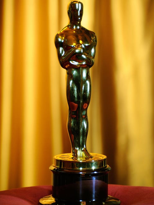 No, Oscar does not look like someone you know. The 8 ½ pound gold-plated award wasn ' t designed from a specific model. Bette Davis (among others) claimed she coined the term " Oscar " based on the posterior likeness to her husband. " But no one knows for sure, " says Haberkamp.