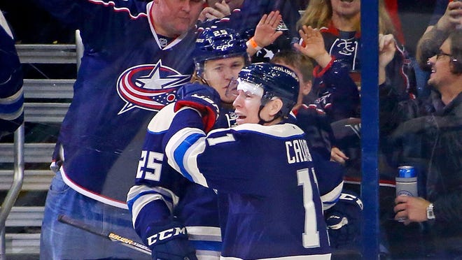 Matt Calvert #11 of the Columbus Blue Jackets is congratulated by William Karlsson #25 of the Columbus Blue Jackets after scoring a short handed, game winning goal, during the third period of the game against the New York Rangers  on November 18, 2016 at Nationwide Arena in Columbus, Ohio. Columbus defeated New York 4-2.