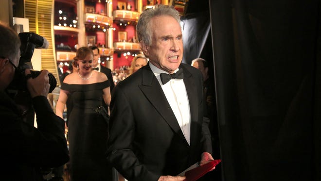 Beatty exits the stage after announcing the award for best picture.