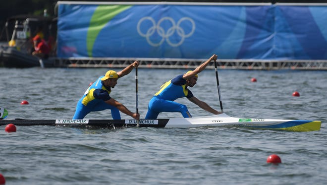 Taras Mishchuk and Dmytro Ianchuk of Ukraine compete in a men's canoe double 1000 semifinal at Lagoa Stadium during the Rio 2016 Summer Olympic Games.