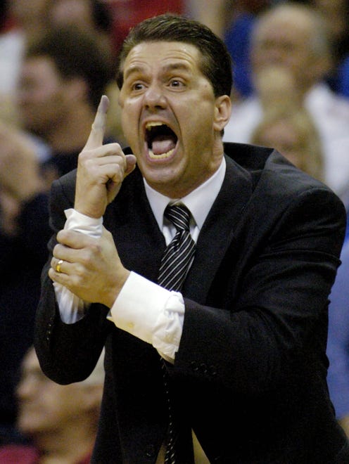 March 12, 2005 - Memphis head coach John Calipari screams to his team to "tough in up, that there is only one minute left in the game."