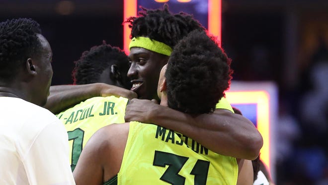 Baylor forward Johnathan Motley embraces teammates after the Bears topped USC to clinch a trip to the Sweet 16.