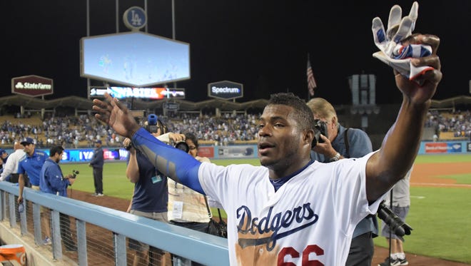 Aug. 16: Dodgers' Yasiel Puig celebrates after hitting a two-run walk-off double against the White Sox. It was Puig's 3rd career walk-off hit and the 10th by the Dodgers this season, most in MLB.