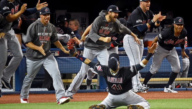 ALCS, Game 5: The Indians rush the field after Carlos Santana makes the final out. The Indians advanced to the World Series.