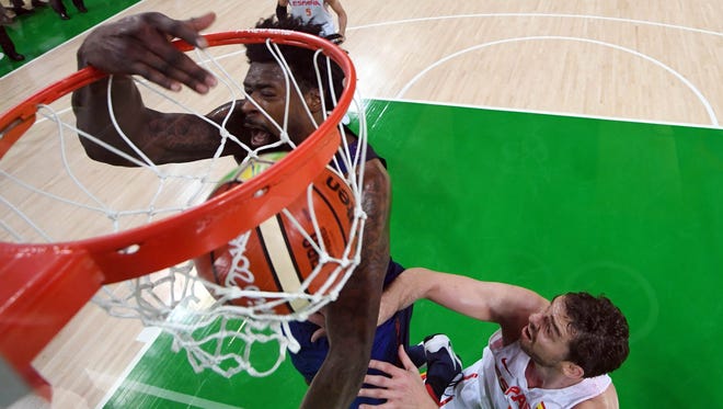 U.S. center DeAndre Jordan, left, throws down a dunk against Spain center Pau Gasol during the men's basketball semifinals.