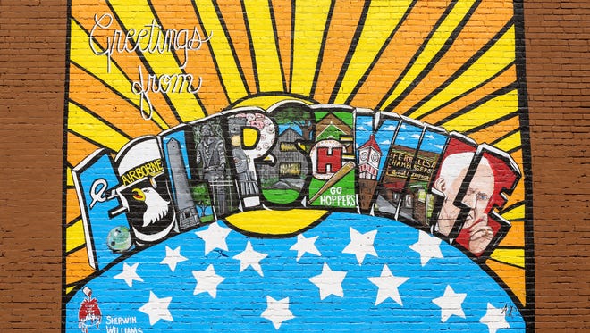 A mural in downtown Hopkinsville says 'Greetings from Eclipseville.' The city is preparing for the total solar eclipse that will draw thousands to the community for the August 21st event.