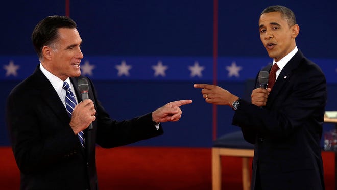 Romney and Obama spar during their debate at Hofstra University in Hempstead, N.Y., on Oct. 16, 2012.