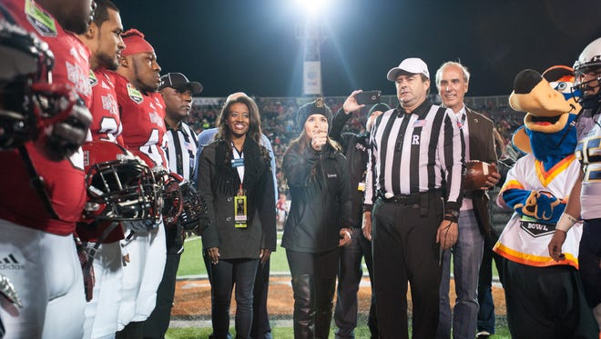 Danica Patrick flips the coin at the 2015 GoDaddy Bowl between the Arkansas State Red Wolves and the Toledo Rockets at Ladd-Peebles Stadium in Mobile, Ala., on Jan. 4.