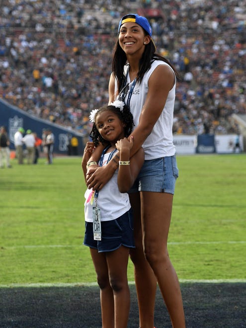 Los Angeles Sparks forward Candace Parker, with her daughter, Lailaa Williams. Parker missed the 2009 season to give birth to Lailaa.