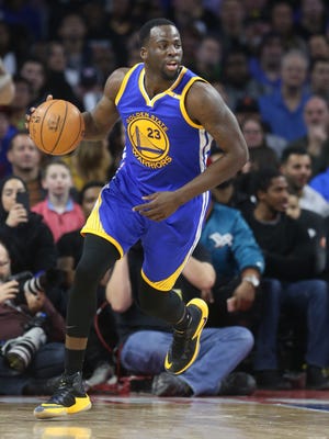 Warriors forward Draymond Green brings the ball upcourt during the fourth period of the Pistons' 119-113 loss to the Warriors Friday at the Palace.
