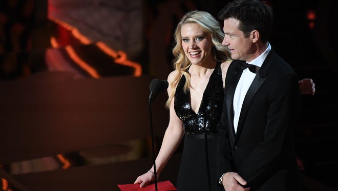 Kate McKinnon and Jason Bateman present the award for Achievement in makeup and hairstyling during the 89th Academy Awards.