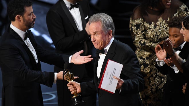 Warren Beatty explains to the audience how he had the wrong award card for best picture during the 89th Academy Awards.