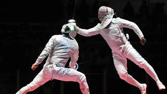 Aug. 10: Aron Szilagyi of Hungary, left, competes against Daryl Homer of the USA during the men’s sabre fencing final. Szilagyi won the match to capture the gold medal, while Homer's silver was the first American medal in the event since 1984.