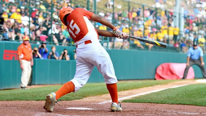 Texas hitter Mark Requena connects on a go-ahead two-run homer during the sixth inning against North Carolina.