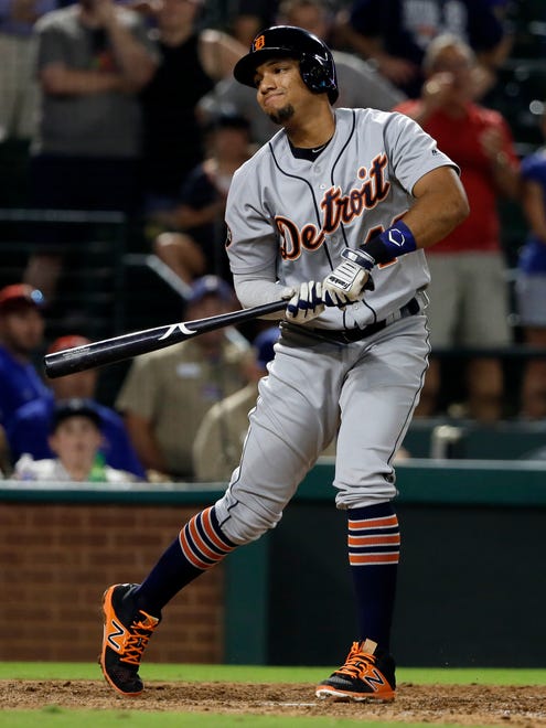 Tigers second baseman Dixon Machado gestures with the bat after striking out with the bases loaded for the final out in the ninth inning of the Tigers' 6-2 loss to the Rangers on Monday, Aug. 14, 2017, in Arlington, Texas.