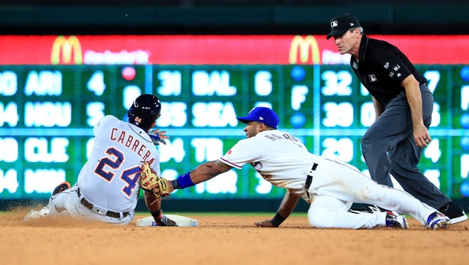 Rangers shortstop Elvis Andrus tags out Tigers designated hitter Miguel Cabrera at second base in the top of the seventh inning of the Tigers' 12-6 loss to the Rangers on Wednesday, Aug. 16, 2017, in Arlington, Texas.