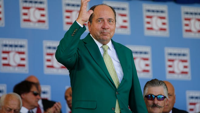 Former Cincinnati Reds great Johnny Bench waves to the crowd as past hall of famers are introduced during the induction ceremony of Ken Griffey Jr. and Mike Piazza into the National Baseball Hall of Fame, Sunday, July 24, 2016, at the Clarks Sports Center in Cooperstown, N.Y.