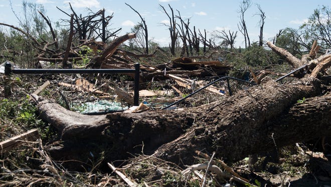 Fallen trees and debris cover the ground on April 30, 2017, in Canton, Texas.