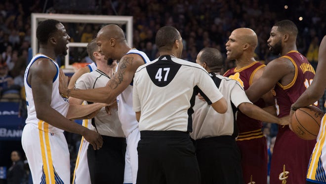 Cleveland Cavaliers forward Richard Jefferson (24) argues with Golden State Warriors forward Draymond Green (23) after colliding with Cavaliers forward LeBron James.