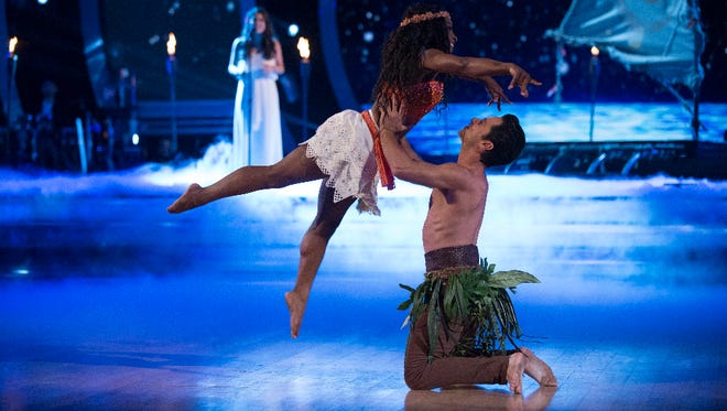 Sasha Farber lifts Simone Biles during their 'Moana'-themed dance.