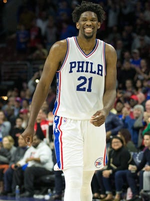 Philadelphia 76ers center Joel Embiid reacts as time winds down on a victory against the Charlotte Hornets at Wells Fargo Center.