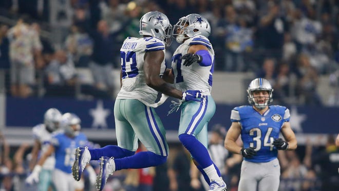 Cowboys defensive end Benson Mayowa (93) celebrates with Damien Wilson (57) after a sack late in the fourth quarter of their rout of the Lions.