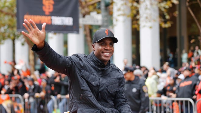 Barry Bonds rides a float in the Giants' 2014 World Series  victory parade. He served as a special instructor for the club that spring.