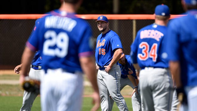 Feb. 27: Tim Tebow participates in drills at the Mets' minor-league camp.