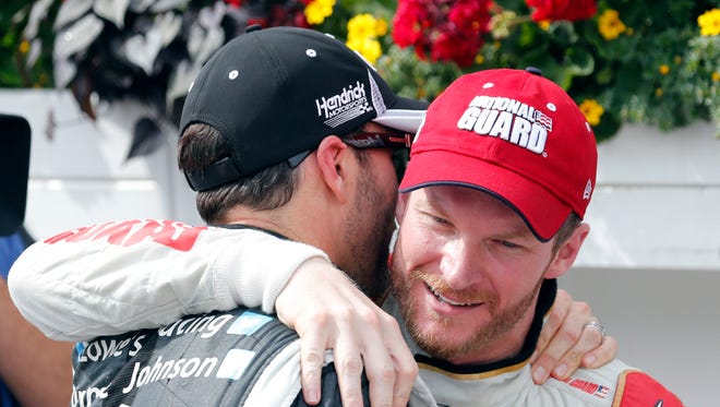 Dale Earnhardt Jr., right, gets a hug from Hendrick Motorsports teammate Jimmie Johnson after Earnhardt's victory at Pocono Raceway on June  8.