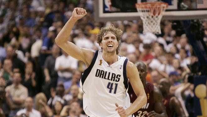 2006: Dallas Mavericks forward Dirk Nowitzki, of Germany, celebrates a basket in the fourth quarter against the Miami Heat.