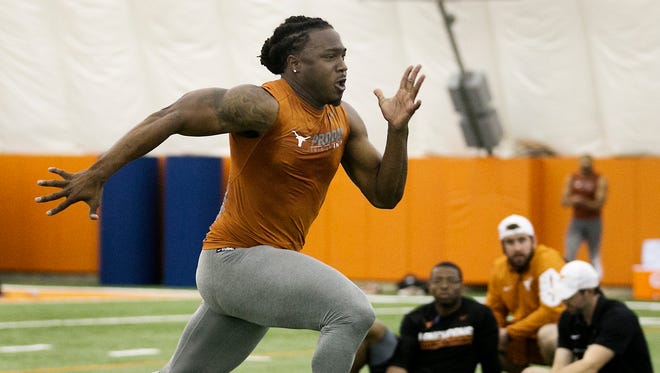 Running back D'Onta Foreman runs at the University of Texas NFL football Pro Day in Austin, Texas, Tuesday March 28, 2017.