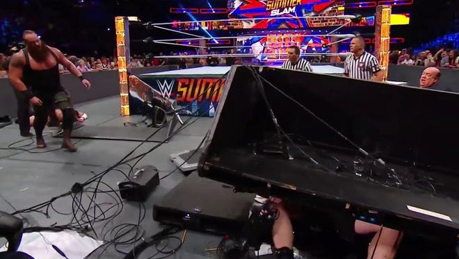 Brock Lesnar got manhandled into the announcers' tables at WWE SummerSlam.