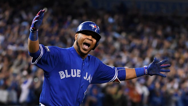 AL wild-card game: Blue Jays' Edwin Encarnacion hits a three-run, walk-off homer in the 11th inning off Ubaldo Jimenez to beat the Orioles 5-2 and advance to the ALDS.