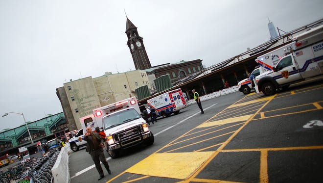 Emergency workers arrive at New Jersey Transit's rail station in Hoboken New Jersey.