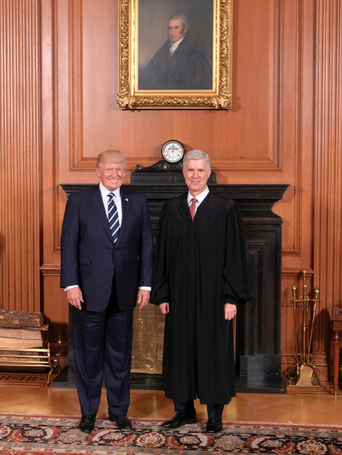 This Supreme Court handout photo shows President Trump and Gorsuch at a courtesy visit in the Justices' Conference Room prior to the investiture ceremony on June 15, 2017.
