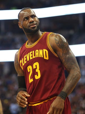 Cleveland Cavaliers forward LeBron James reacts during the first half against the Denver Nuggets.