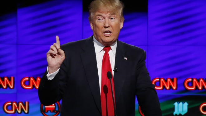 In this March 10, 2016, file photo, Donald Trump, speaks during the Republican debate in Coral Gables, Fla.