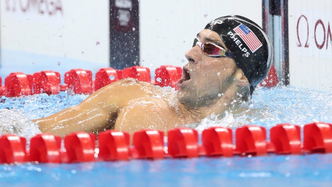 Michael Phelps reacts after winning the men's 200-meter individual medley.
