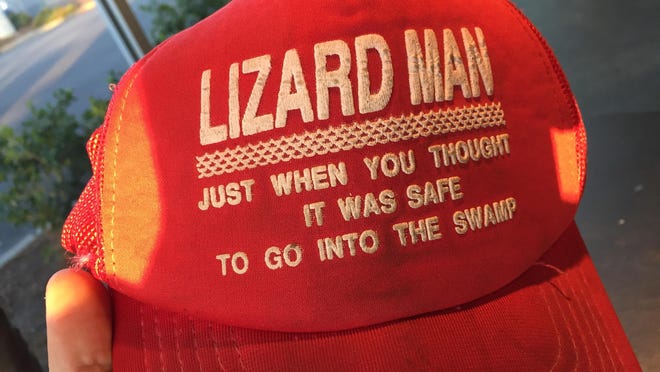 Baseball caps such as this, T-shirts and green-tinted lemonade called Lizard Juice were sold along the side of the road in Lee County when the tale of the Lizard Man spread in 1988.